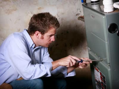 man fixing furnace installation and replacement