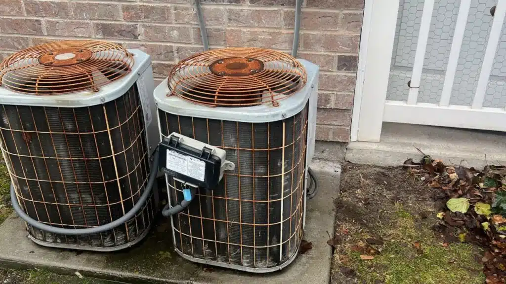 Here are two old air conditioners in a duplex that need to be replaced.