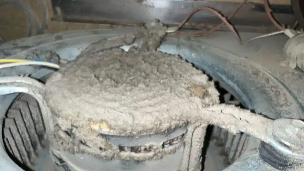Before image of an extremely dusty motor blower that needs maintenance. This is filled with things that are bad for your health and create poor indoor air quality.